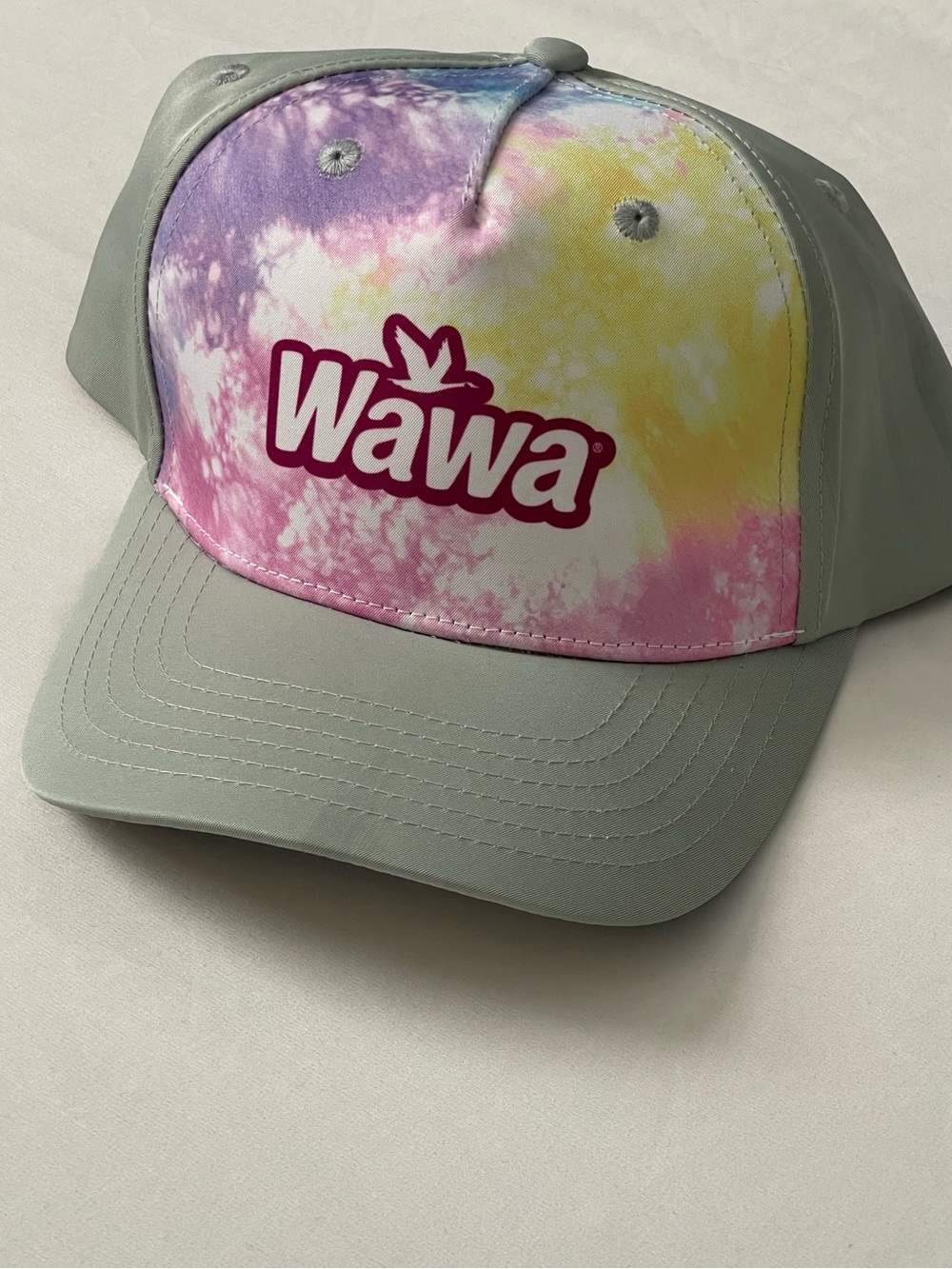Wawa 2026 Hoagiefest Pastel Tie-Dye Hat - Pink/Yellow/Purple- With a Gray rim.